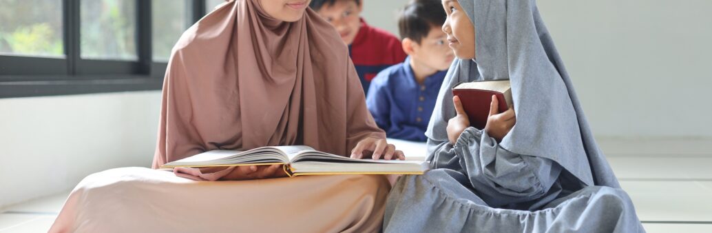 asian-muslim-girls-in-hijab-learning-about-islam-religion